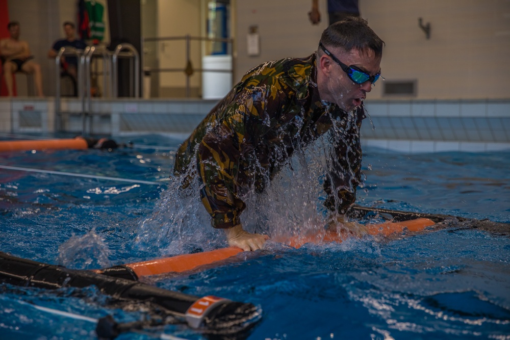 First Lieutenant Michael K. Vigh propels over a barrier