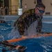 First Lieutenant Michael K. Vigh propels over a barrier