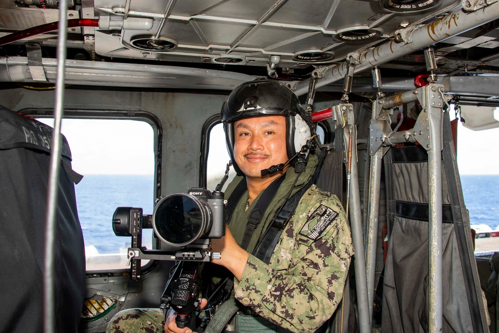 USS Carl Vinson (CVN 70) sailor participates in RIMPAC 2024 photo exercise.