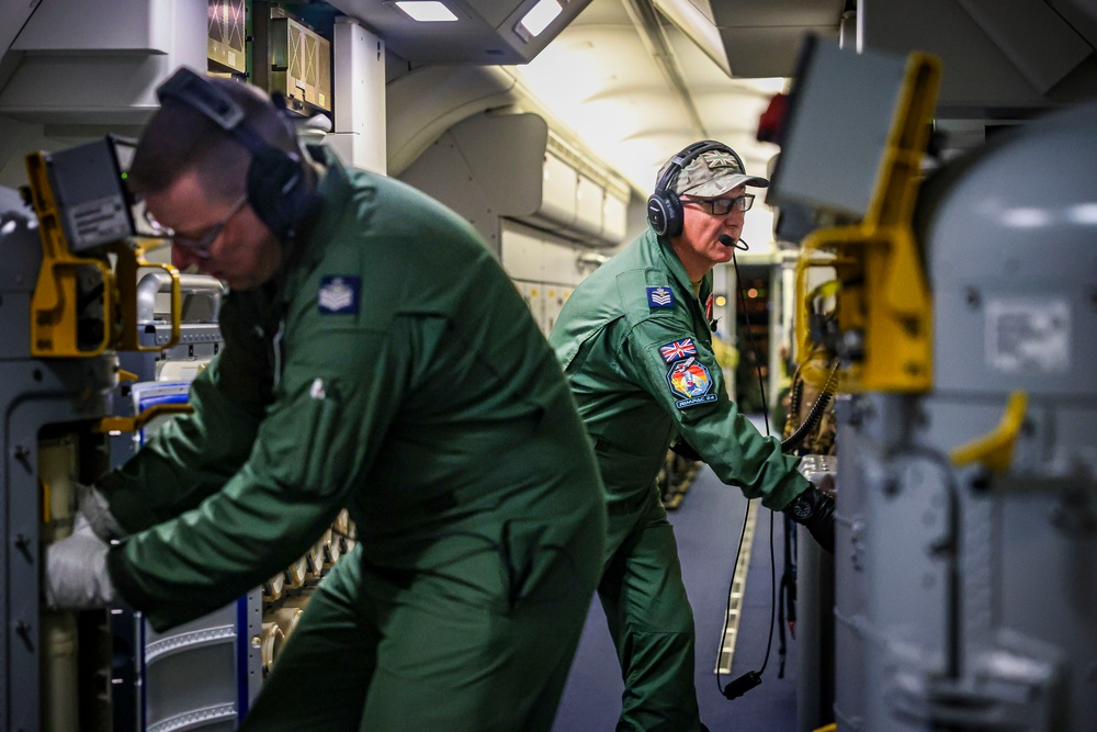 Royal Air Force P-8 crew loading antisubmarine sonobuoys during RIMPAC 2024