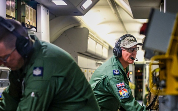 Royal Air Force P-8 crew loading antisubmarine sonobuoys during RIMPAC 2024