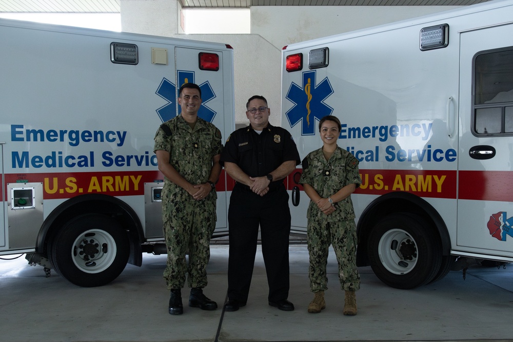 Sailors and Firefighters are recognized for acquisition of three ambulances from Camp Humphreys