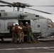 Capt. Pete Riebe participates in helicopter operations aboard Abraham Lincoln