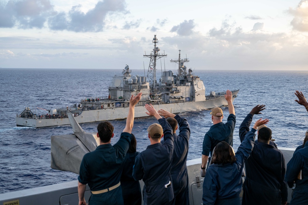 USS Somerset (LPD 25) waves to USS Princeton (CG 59) during RIMPAC 2024