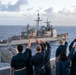 USS Somerset (LPD 25) waves to USS Princeton (CG 59) during RIMPAC 2024