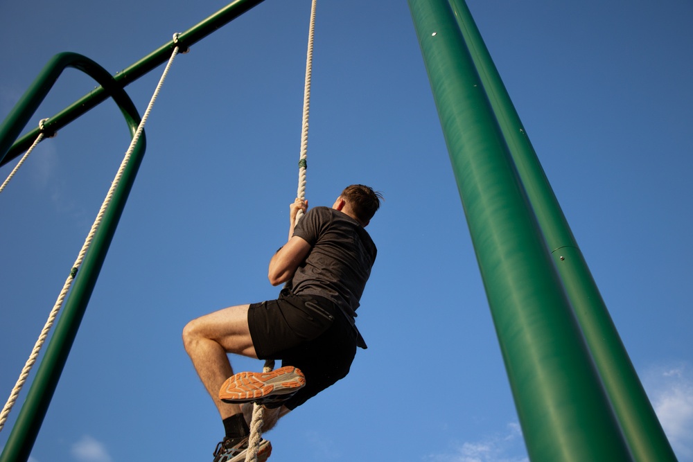 10th SFG(A) Soldier climbs rope