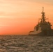 Coast Guard Cutter Stone steams at sunset in the Atlantic Ocean