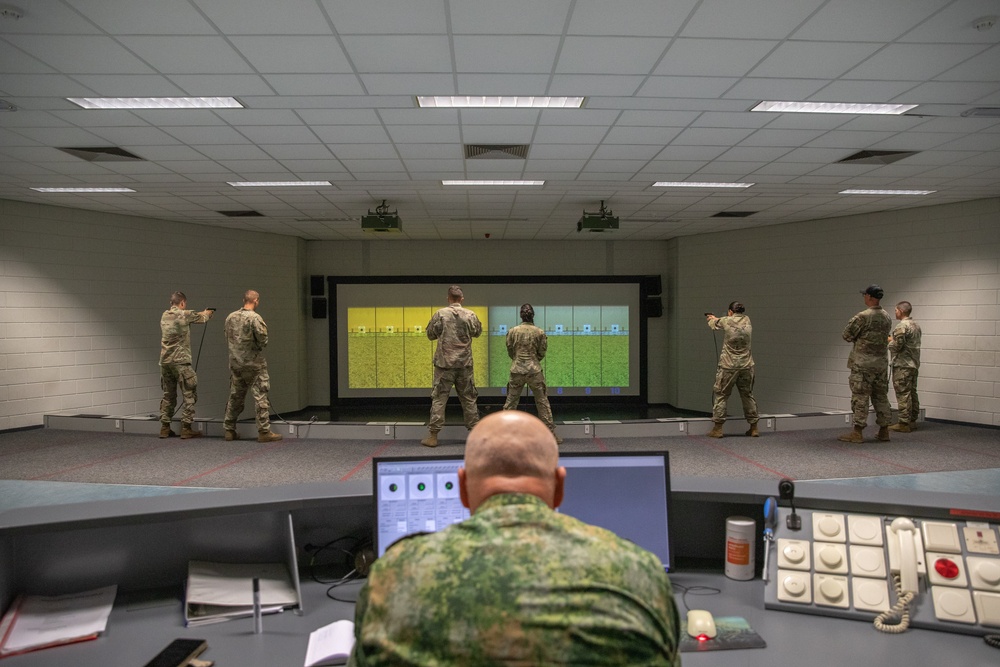 Sgt. Maj. Klass Visser operates a weapon sim for team USA