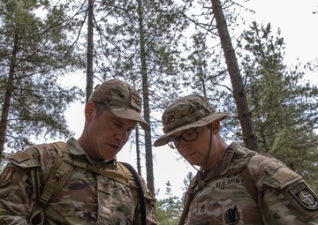 Col. Brent Dishman checks map with Staff Sgt. Zachary Mills