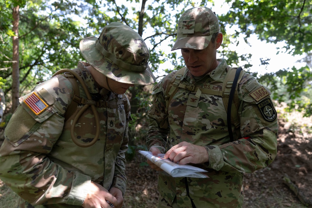 Two team USA members looking at a map