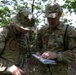 Two team USA members looking at a map