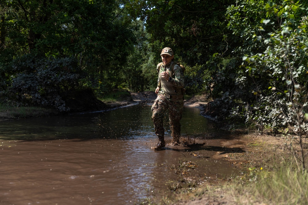 Maj. Mandy Kannapel runs through pooled water