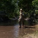 Maj. Mandy Kannapel runs through pooled water