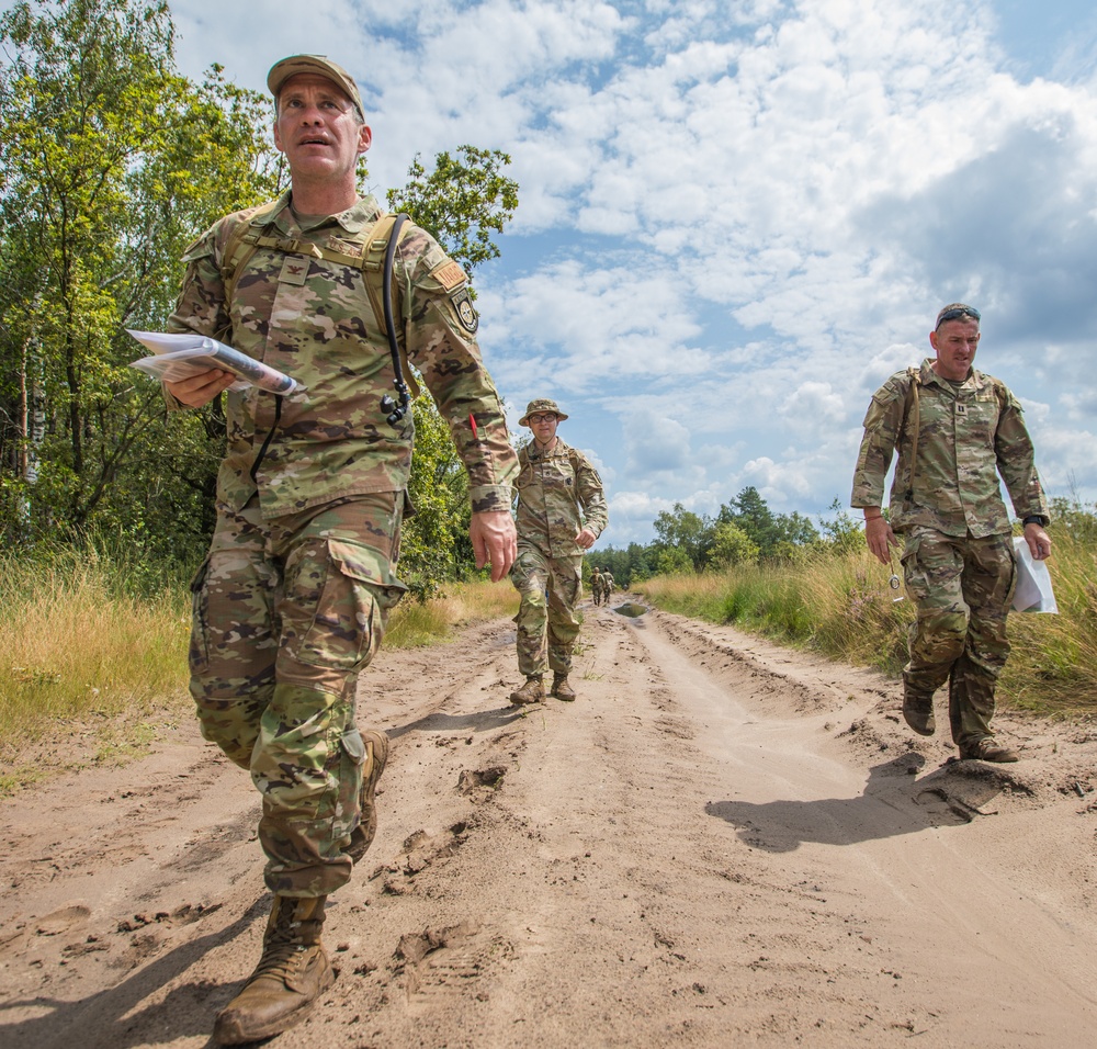 Service members representing team USA navigate a trail at Oirschotse Heide trail