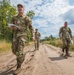 Service members representing team USA navigate a trail at Oirschotse Heide trail