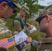 Service members representing team USA check their map to acquire their next control