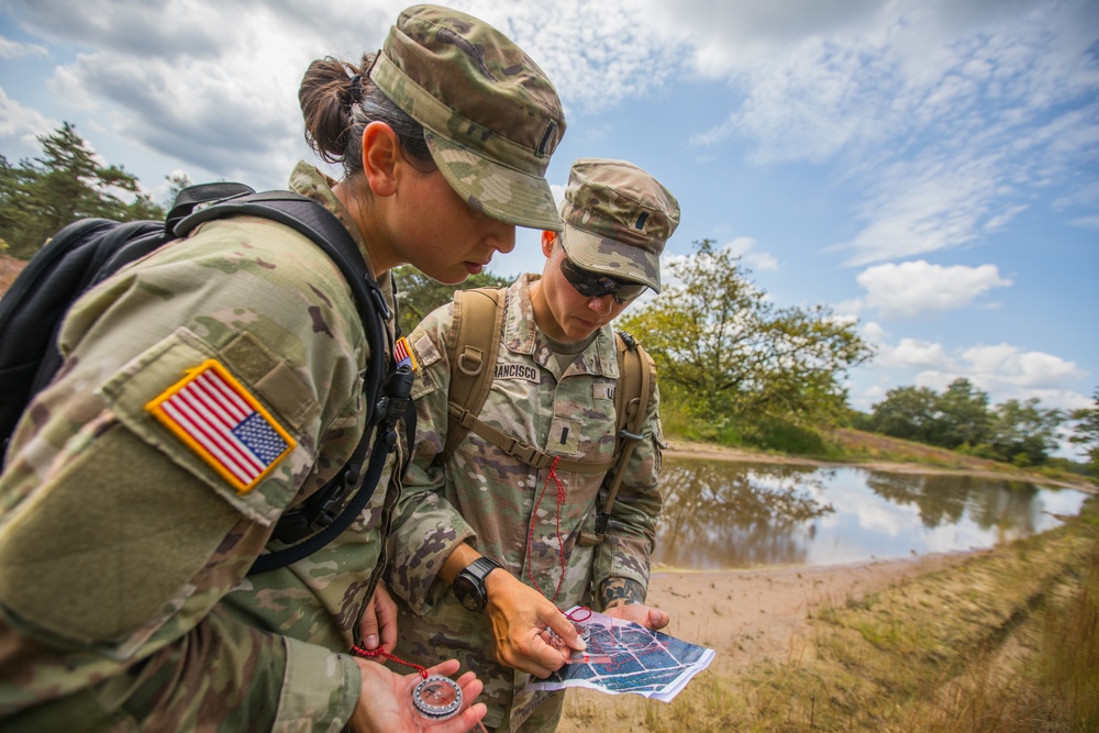 U.S. Army servicewomen shoot an azimuth to navigate to their next control point