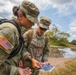 U.S. Army servicewomen shoot an azimuth to navigate to their next control point