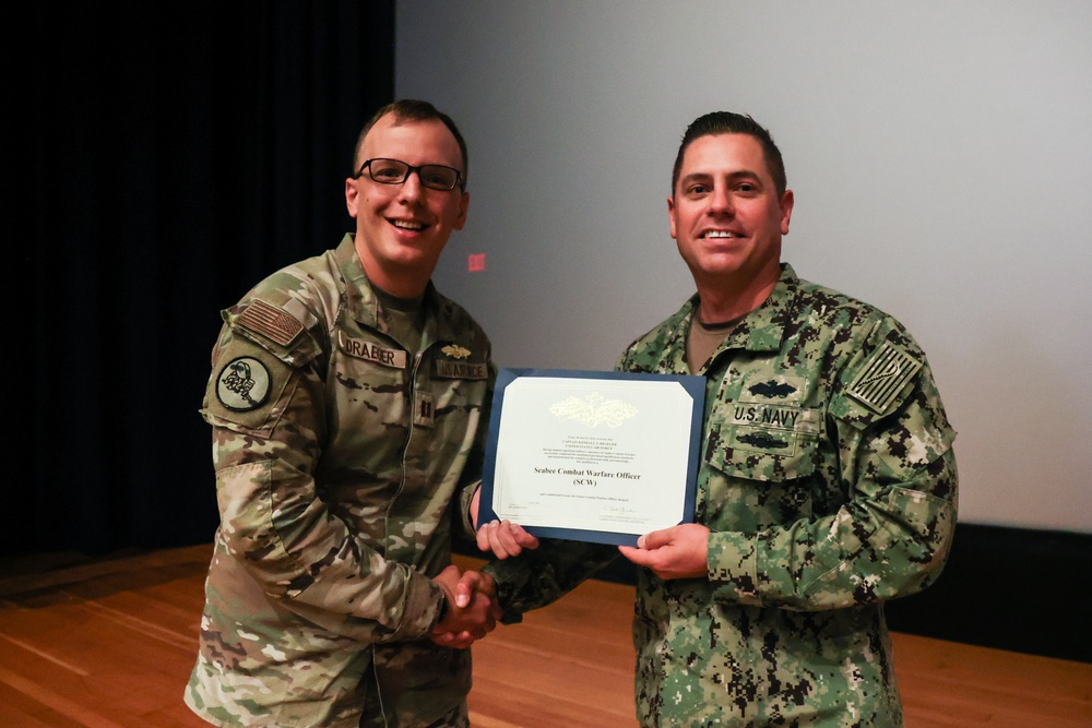 Airforce Captain is Awarded the Seabee Combat Warfare Specialist Pin