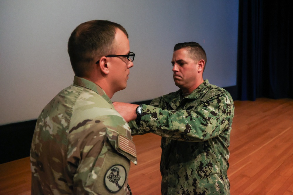 Airforce Captain is Awarded the Seabee Combat Warfare Specialist Pin