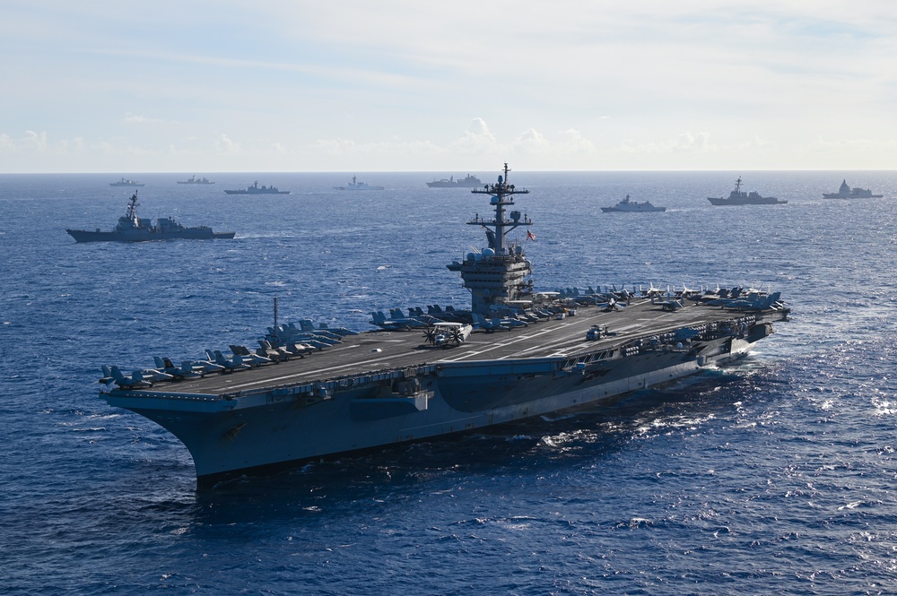 Multinational ships sail in formation during RIMPAC 2024