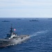 Multinational ships sail in formation during RIMPAC 2024