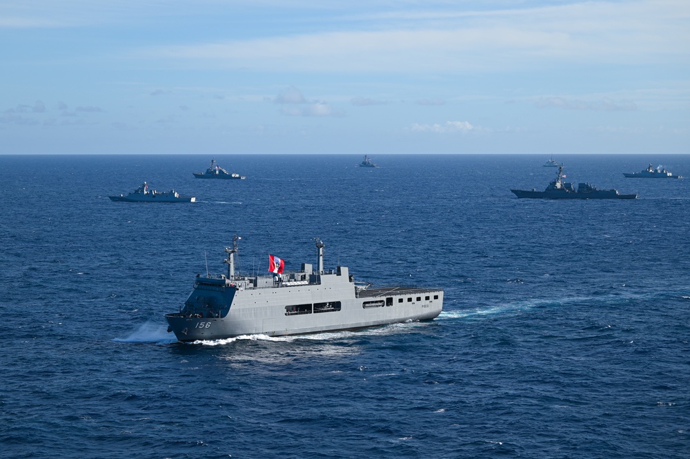 Multinational ships sail in formation during RIMPAC 2024