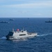 Multinational ships sail in formation during RIMPAC 2024