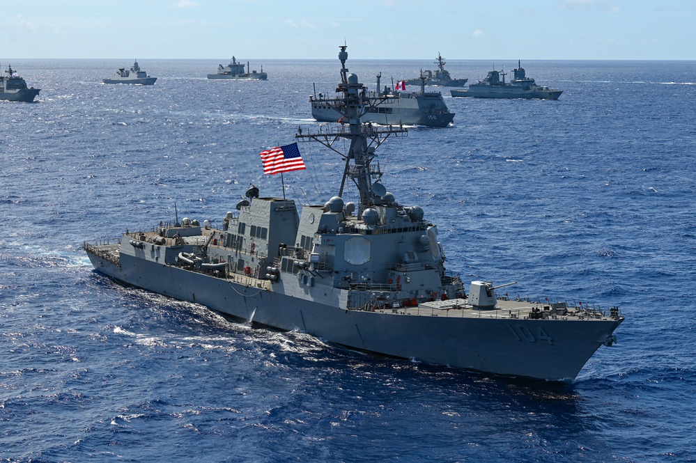 Multinational ships sail in formation during RIMPAC 2024