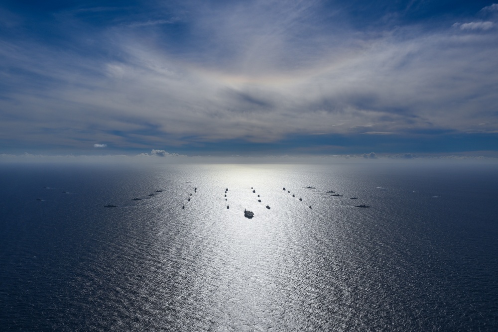 Multinational ships sail in formation during RIMPAC 2024