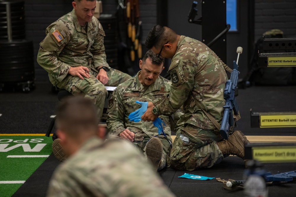 Members of team USA  conduct a Tactical Combat Casualty care practice