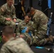 Members of team USA  conduct a Tactical Combat Casualty care practice