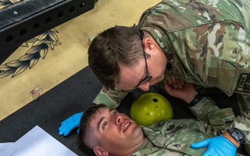 Staff Sgt. Zachary Mills conducts Tactical Combat Casualty Care