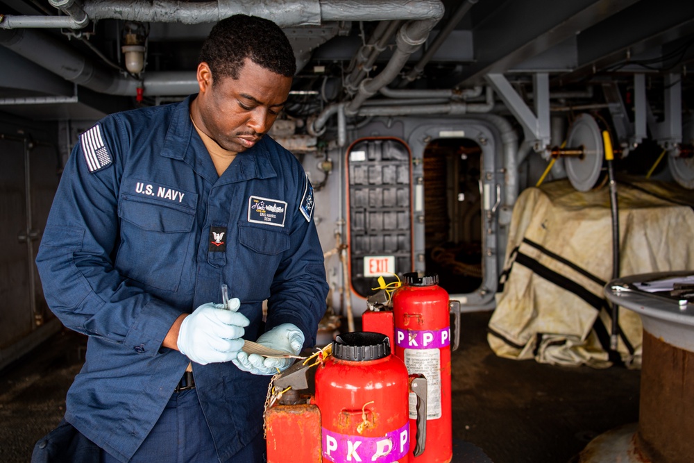 Nimitz Sailor Conducts PKP Bottle Maintenance