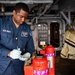 Nimitz Sailor Conducts PKP Bottle Maintenance