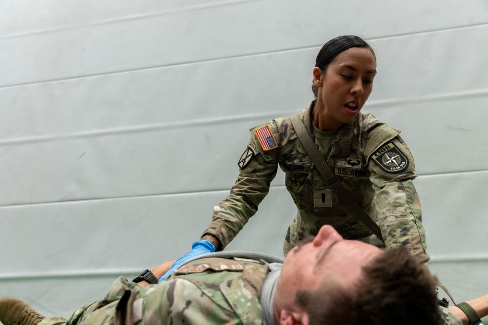 1st Lt. Jessica Romero applies a bandage to a casualty