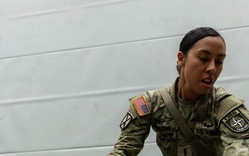 1st Lt. Jessica Romero applies a bandage to a casualty