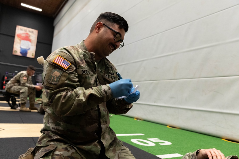 Sgt. 1st Class David Duran writes down casualty information