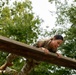 1st Lt. Jessica Romero jumps over an obstacle