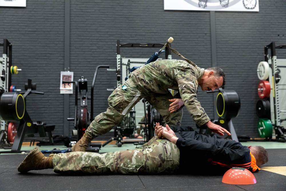 Lt. Col. Thomas Sebastiani detains a simulated foreign combantant