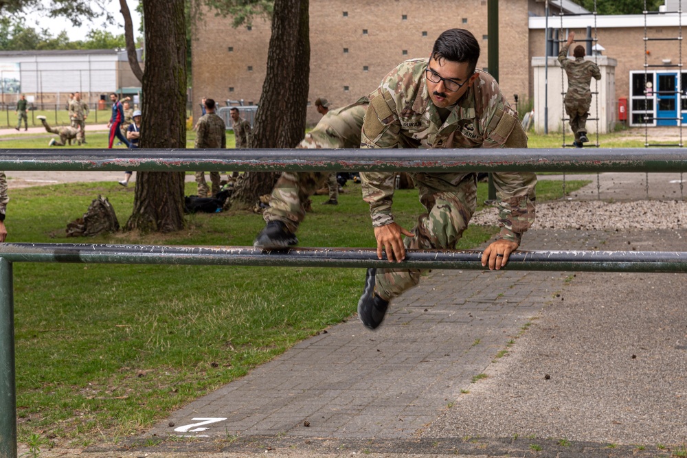 Sgt. 1st Class David Duran leaps over an obstacle