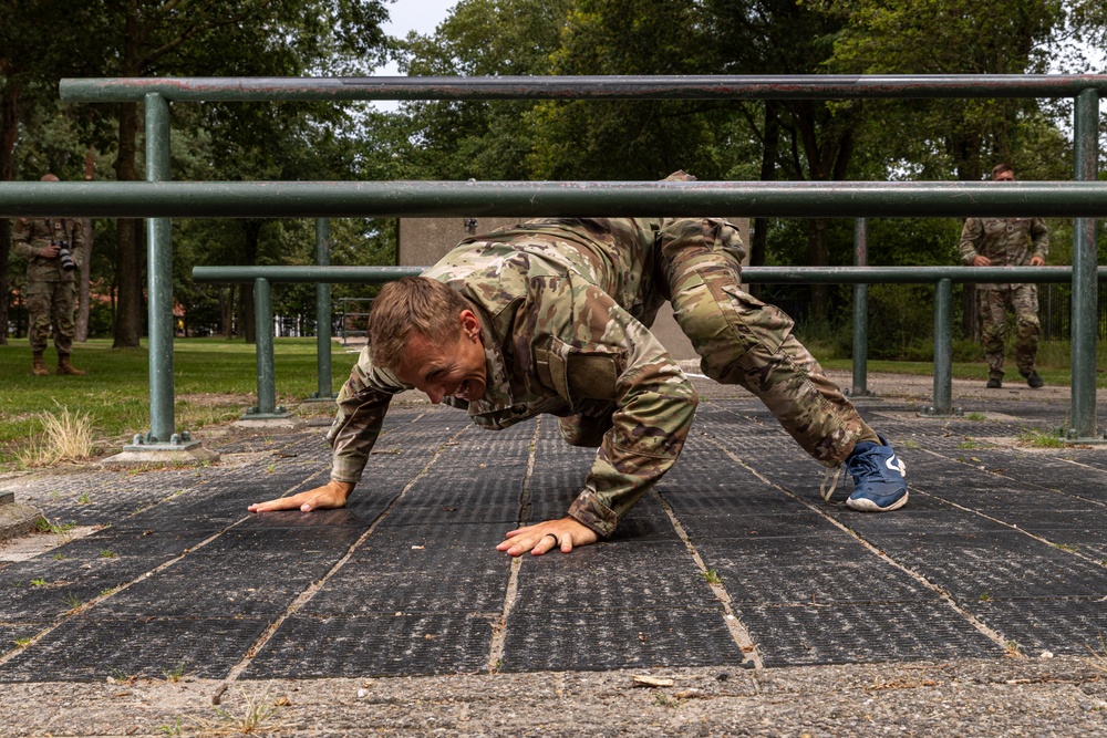 Sgt. Thomas Doles crawls under an obstacle