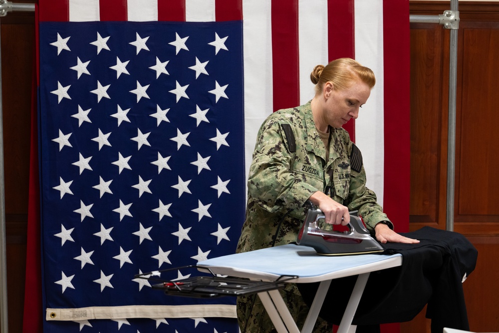 AFMAO Navy mortician prepares uniform