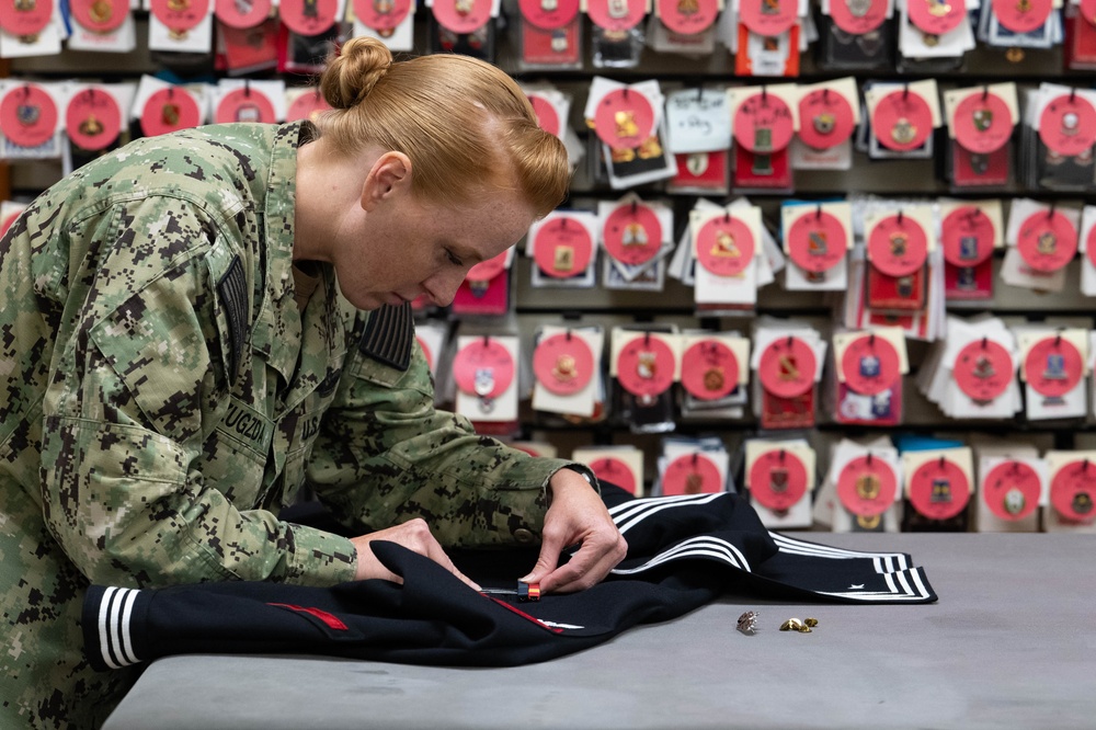 AFMAO Navy mortician prepares uniform