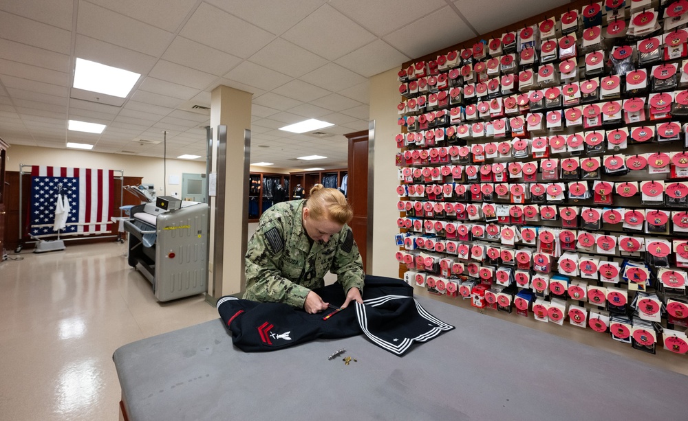 AFMAO Navy mortician prepares uniform