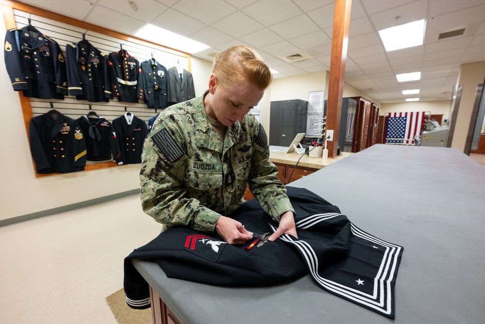 AFMAO Navy mortician prepares uniform