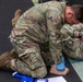 Sgt. 1st Class Benjamin Latham provides Tactical Combat Casualty Care