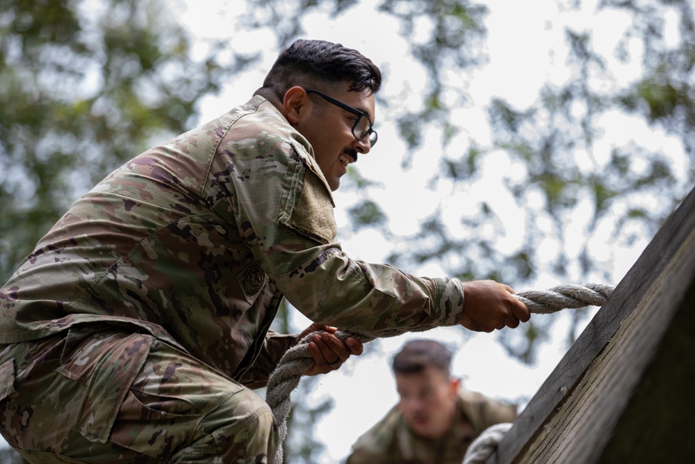 Sgt. 1st Class David Duran climbs a wall