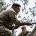 Sgt. 1st Class David Duran climbs a wall