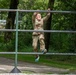 Sgt. Thomas Hunt jumps to an obstacle